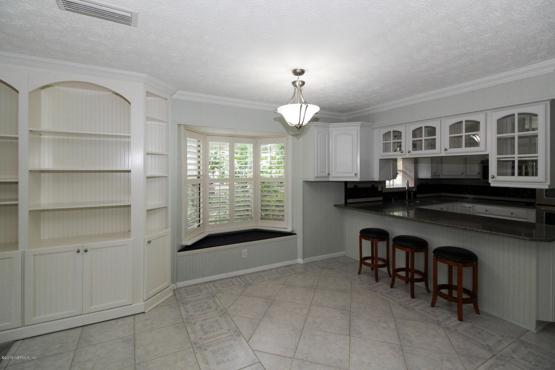 2015 Cornell Road Middleburg, FL 32068 - Photo 10 of 42 a view of kitchen with cabinets and window