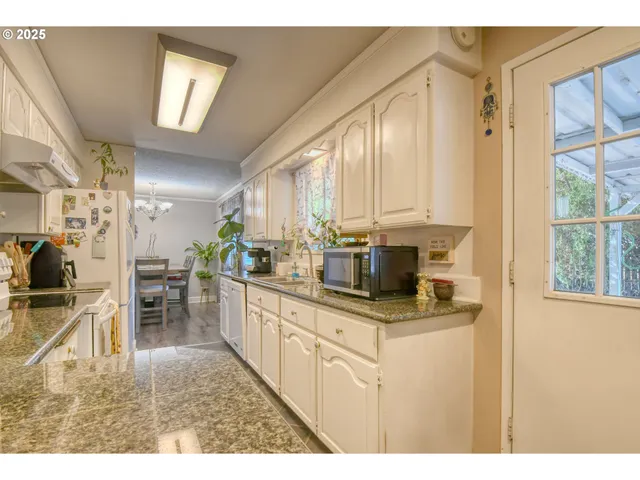 a bedroom with a bed and a lamp