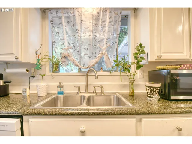 a bedroom with a bed and a television