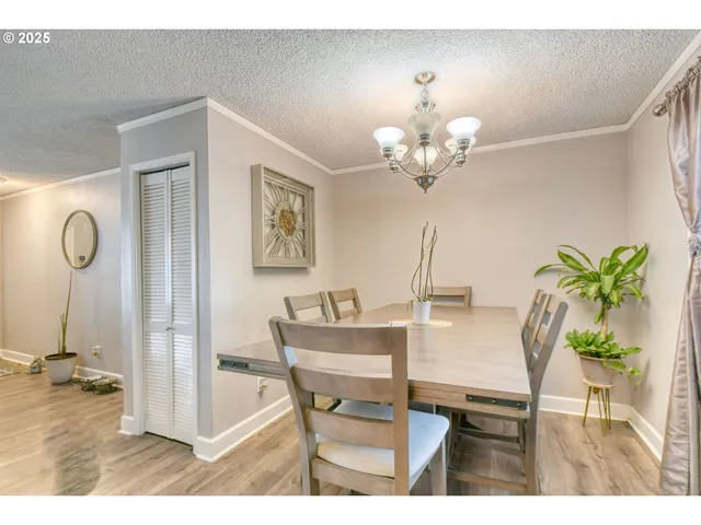 a open kitchen with stainless steel appliances kitchen island granite countertop a refrigerator and a sink