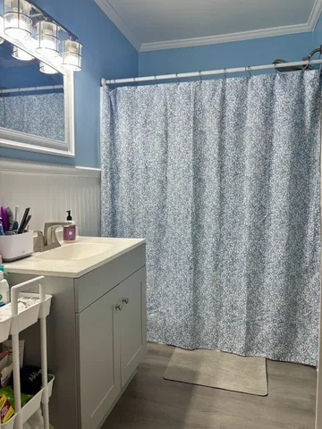 a utility room with a sink and a window