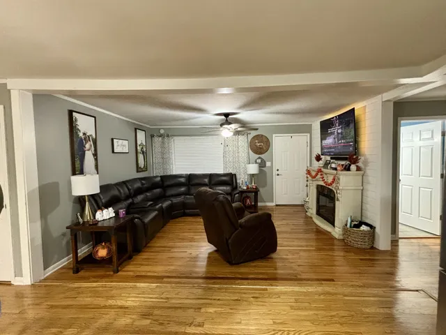 a living room with furniture and a flat screen tv
