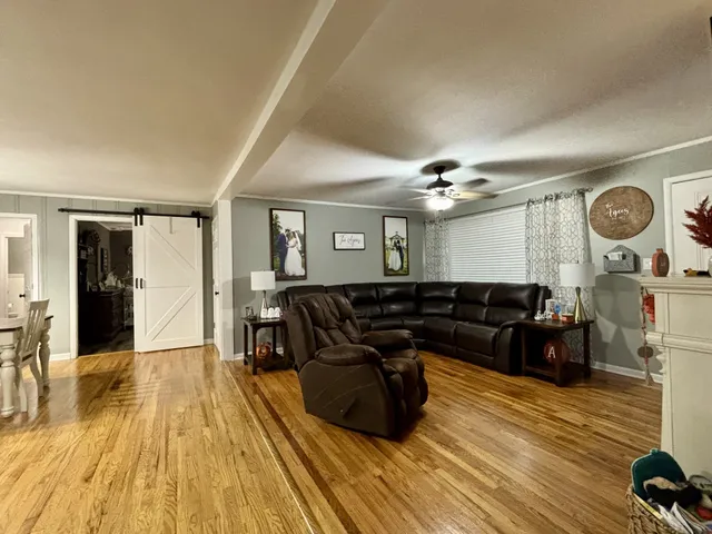 a living room with couch and wooden floor