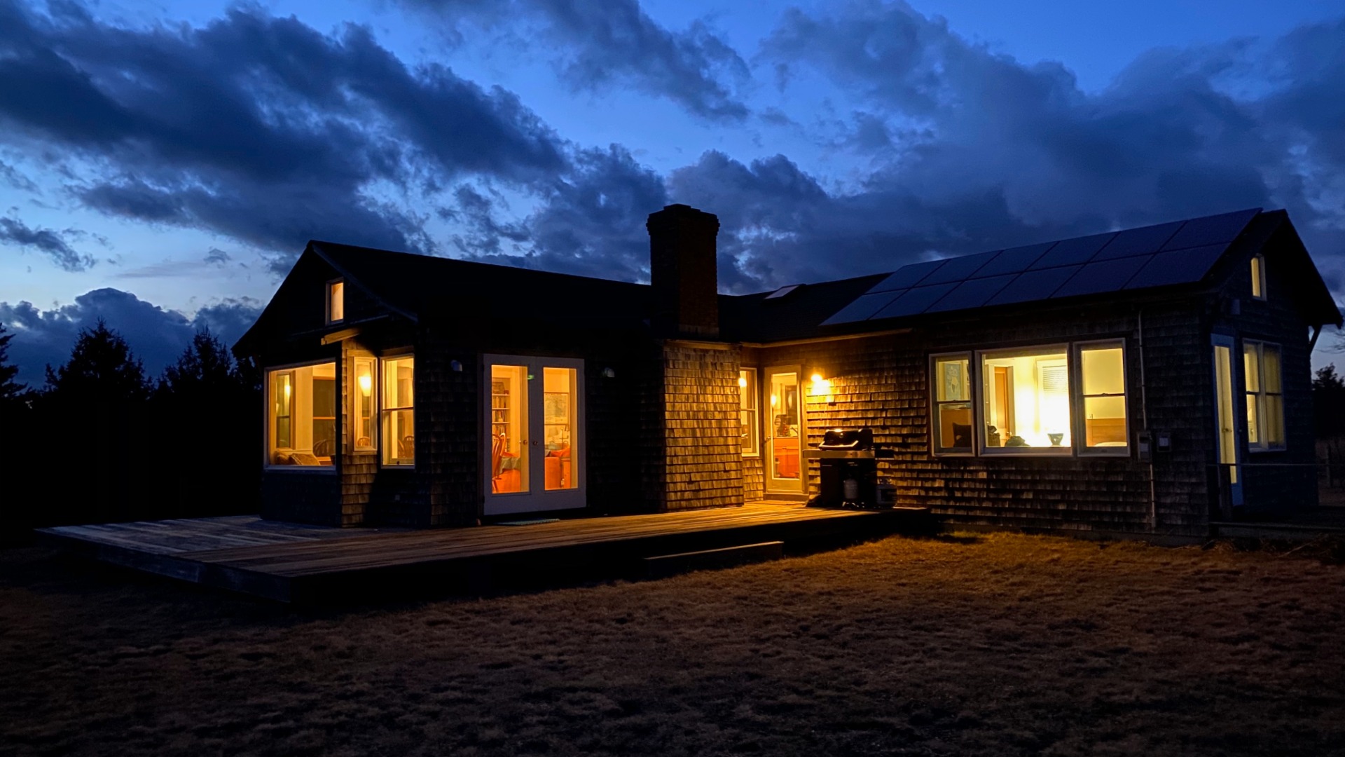 144 Pond View Farm Road West Tisbury, MA 02568 - Photo 3 of 13 a living room with large windows