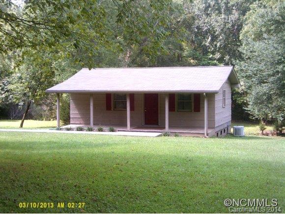 341 Rock Road Rutherfordton, NC 28139 - Photo 2 of 12 a front view of a house with a garden and porch