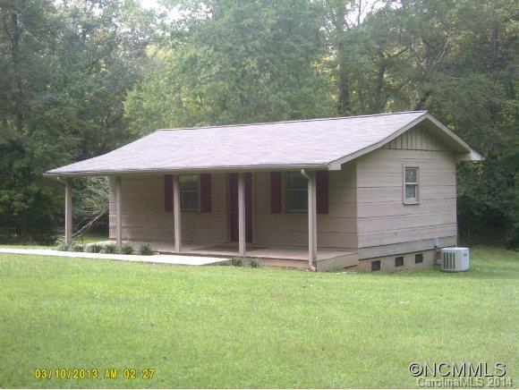 341 Rock Road Rutherfordton, NC 28139 - Photo 4 of 12 a front view of a house with a garden