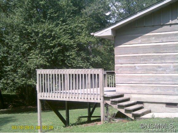 341 Rock Road Rutherfordton, NC 28139 - Photo 8 of 12 a view of backyard with a deck and furniture