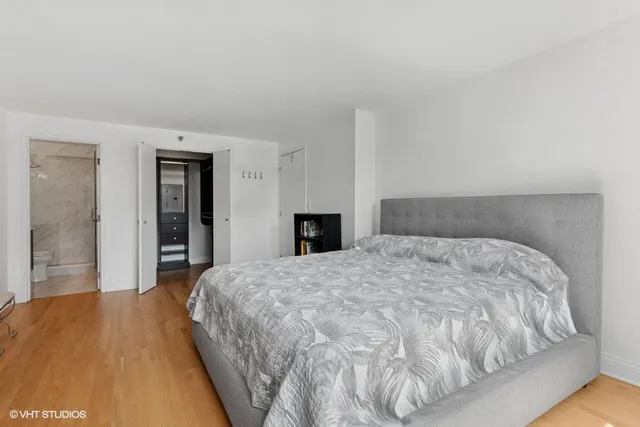 a bedroom with a bed and a dresser