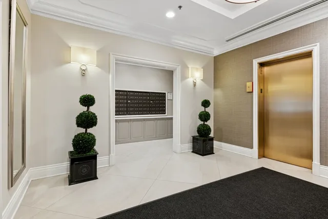 a man sitting on a bench in a bathroom