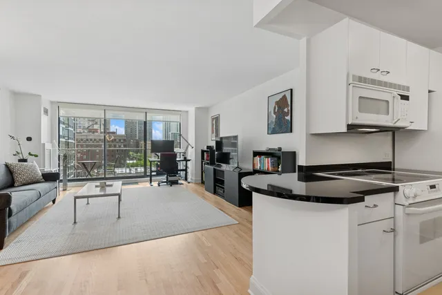 a kitchen with stainless steel appliances granite countertop a sink and cabinets