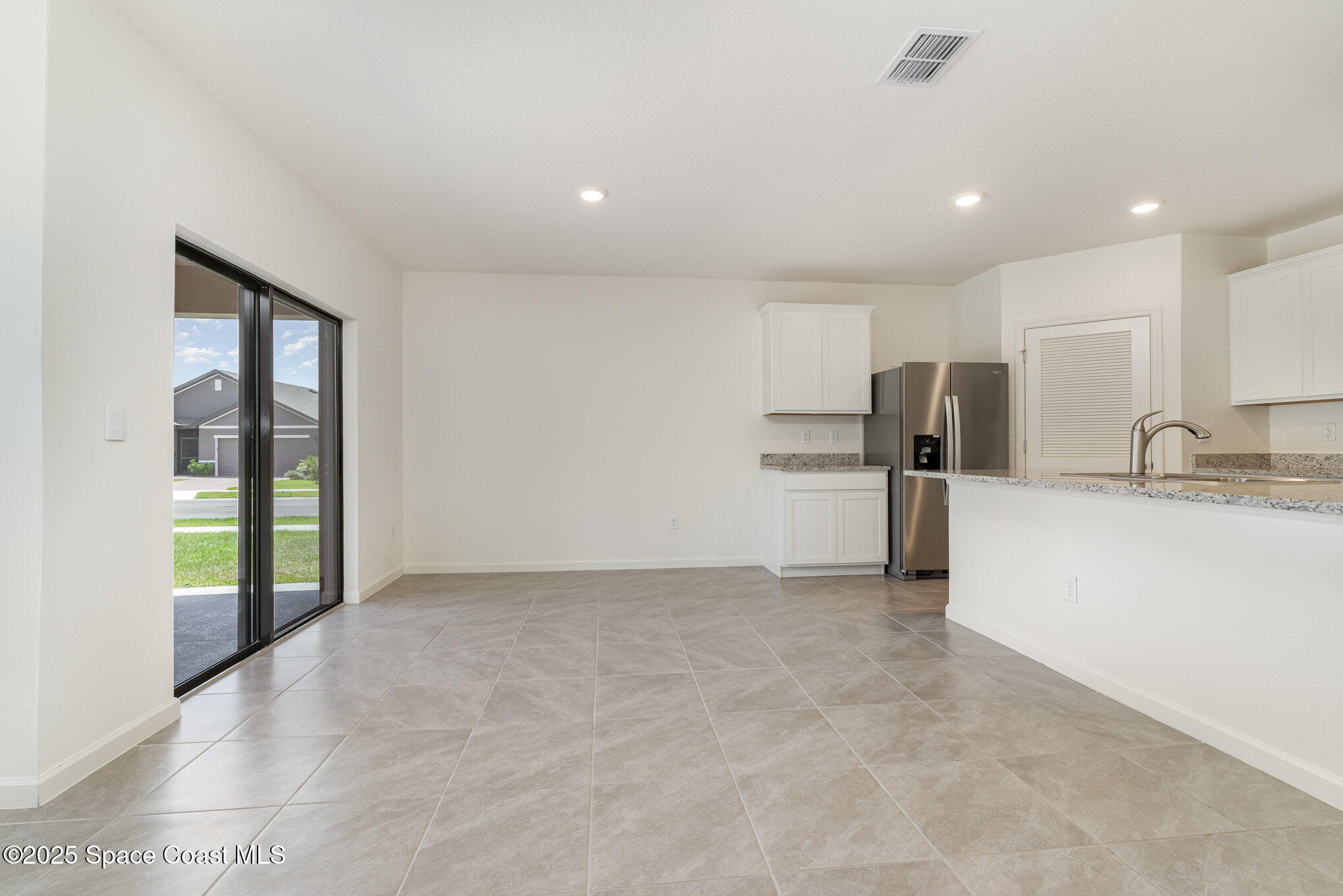 6714 Topaz Drive Grant-Valkaria, FL 32949 - Photo 13 of 33 a view of kitchen with refrigerator and sink