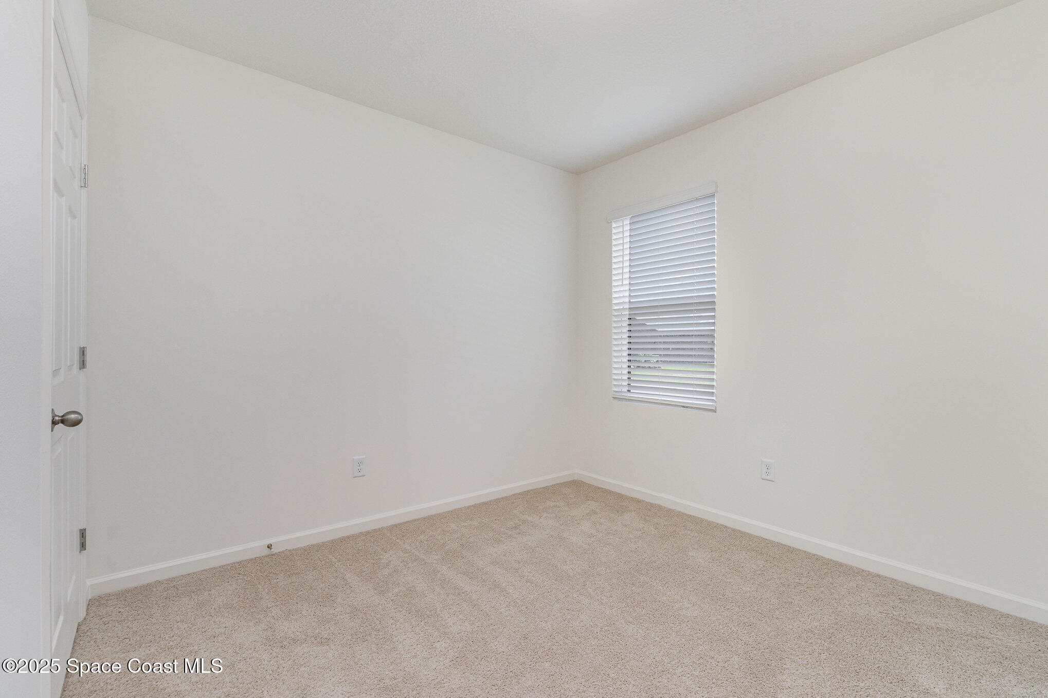 6714 Topaz Drive Grant-Valkaria, FL 32949 - Photo 20 of 33 an empty room with a window