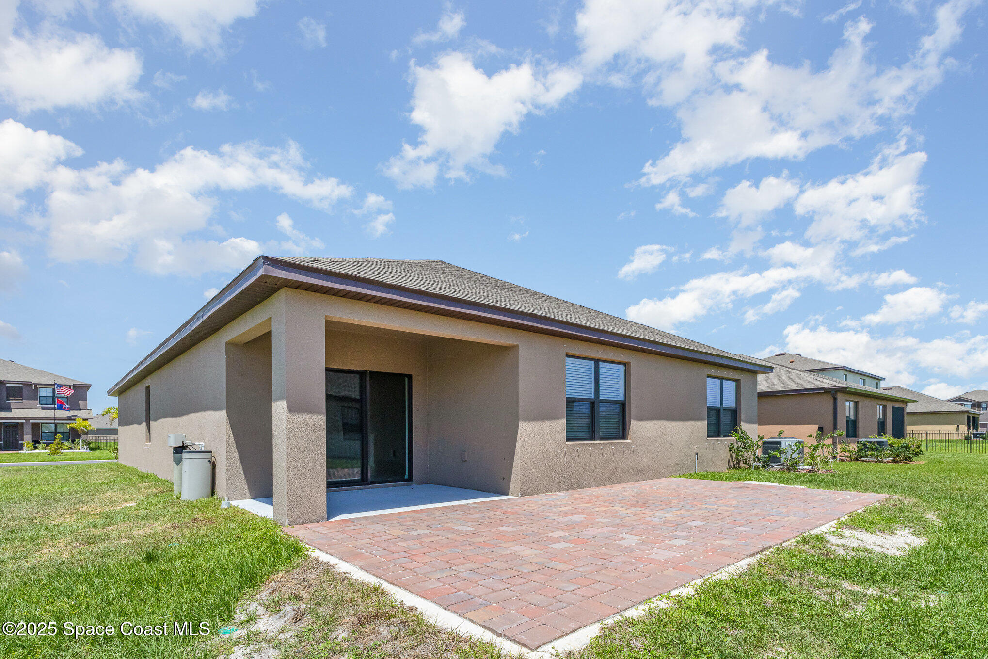 6714 Topaz Drive Grant-Valkaria, FL 32949 - Photo 25 of 33 a front view of a house with yard