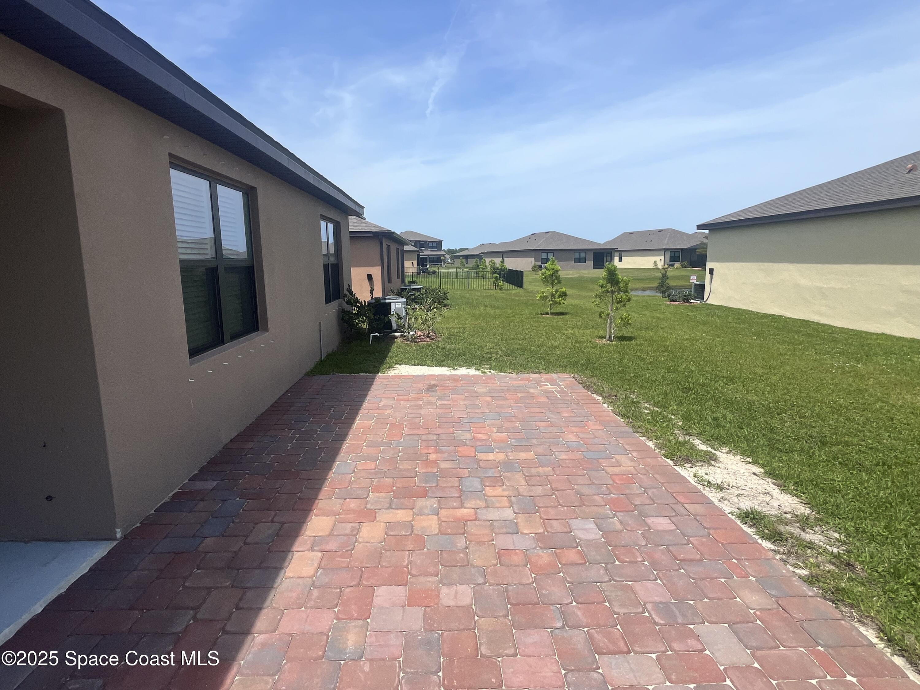 6714 Topaz Drive Grant-Valkaria, FL 32949 - Photo 27 of 33 a view of swimming pool with a yard