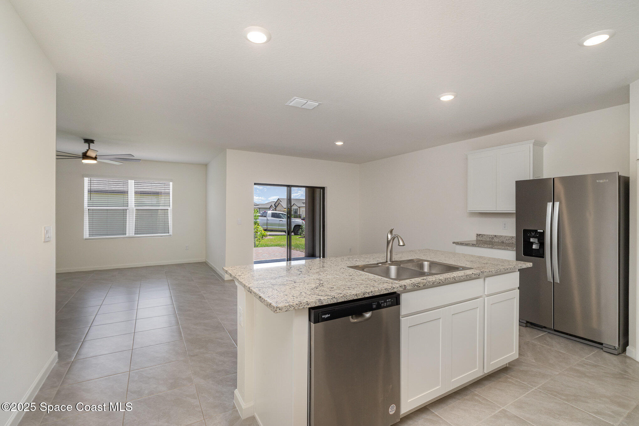 6714 Topaz Drive Grant-Valkaria, FL 32949 - Photo 3 of 33 a kitchen that has a sink a oven a refrigerator and a counter top space