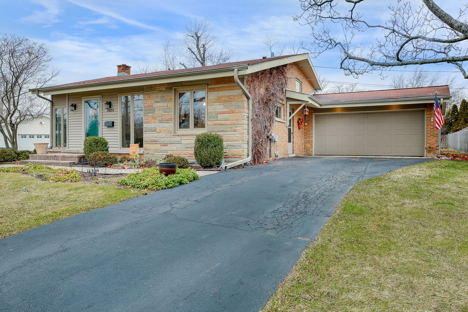 5924 Carpenter Street Downers Grove, IL 60516 - Photo 1 of 28 a front view of a house with a yard