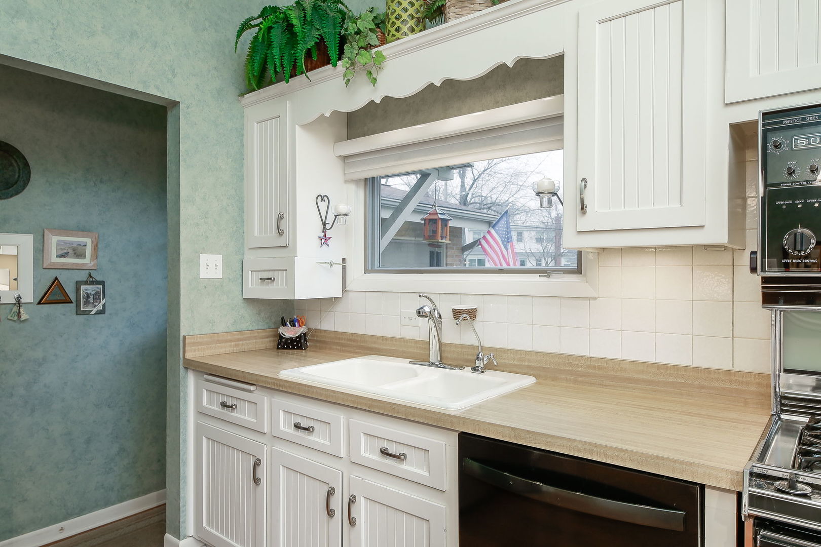 5924 Carpenter Street Downers Grove, IL 60516 - Photo 13 of 28 a bathroom with a sink and a mirror