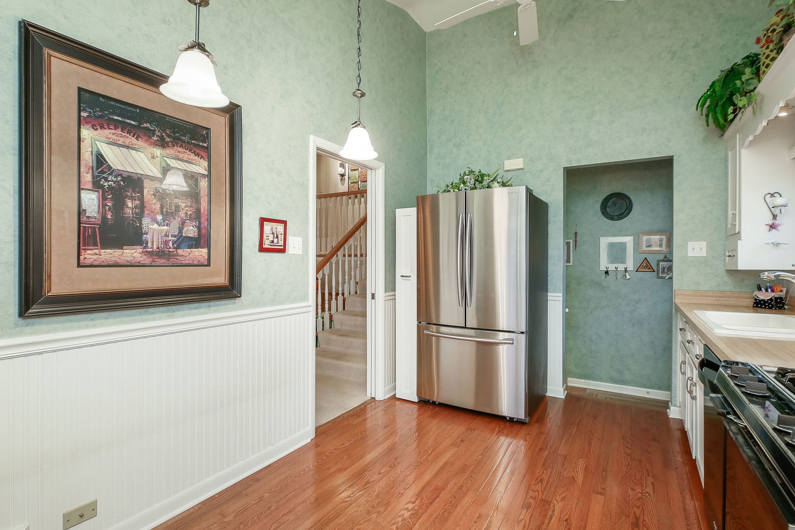 5924 Carpenter Street Downers Grove, IL 60516 - Photo 14 of 28 a kitchen with stainless steel appliances a refrigerator and a stove top oven