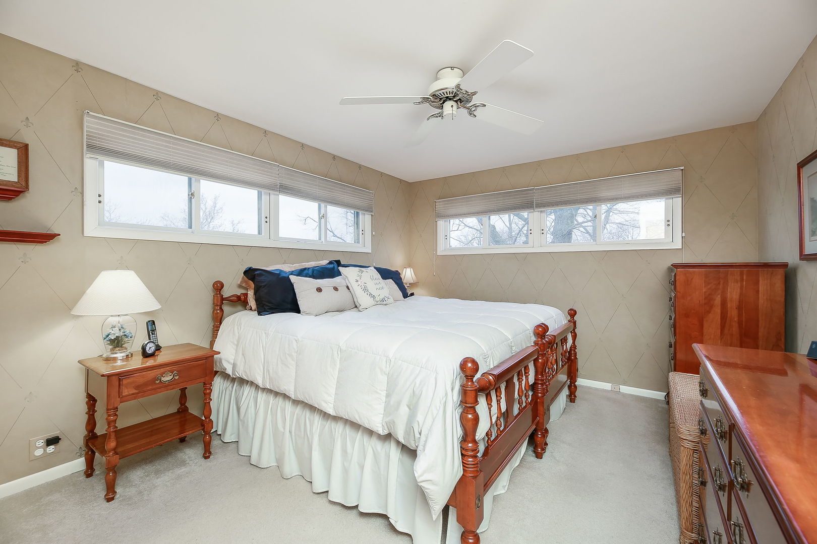 5924 Carpenter Street Downers Grove, IL 60516 - Photo 16 of 28 a bedroom with a bed and a chandelier