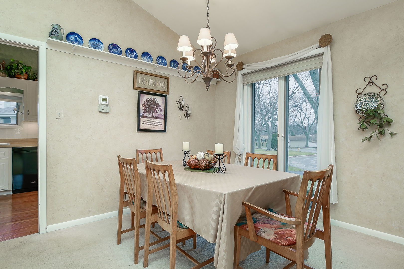 5924 Carpenter Street Downers Grove, IL 60516 - Photo 10 of 28 a dining room with furniture a chandelier and window
