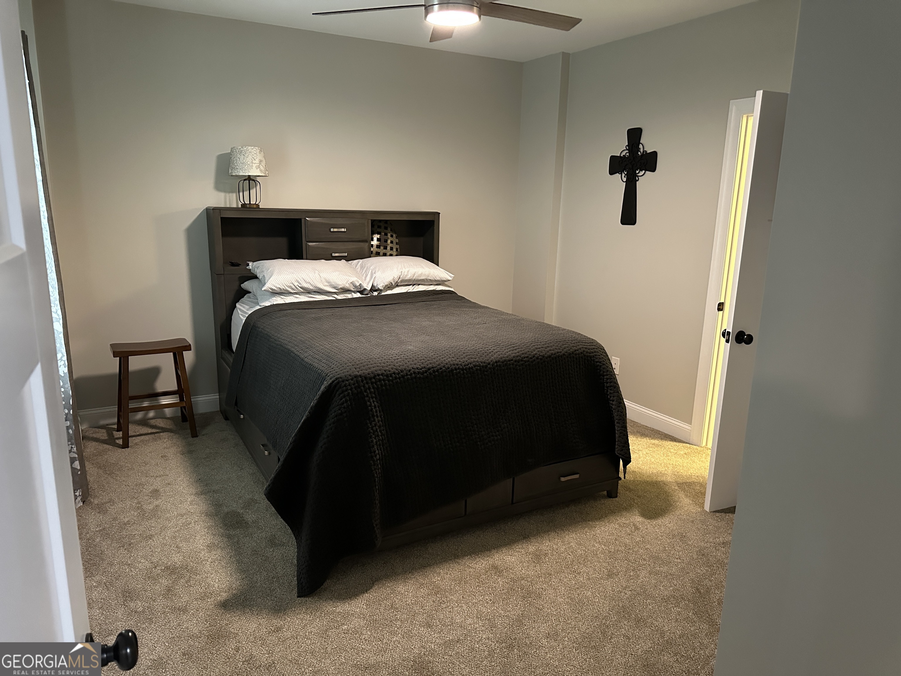 88 Old Vineyard Way Cleveland, GA 30528 - Photo 5 of 8 a bedroom with a bed and a cabinet