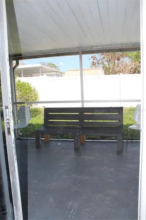 a view of room with window and furniture