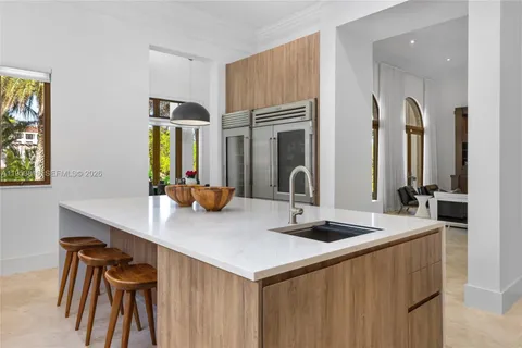 a kitchen with stainless steel appliances granite countertop a sink and a stove