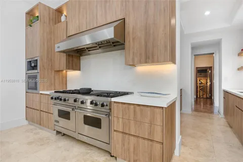 a kitchen with sink cabinets and window