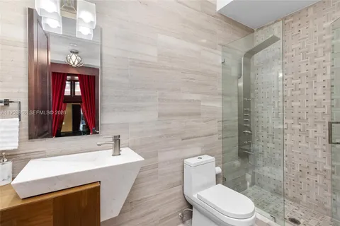 a spacious bedroom with a large bed and a large window