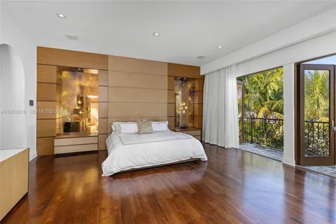 a bathroom with a shower a sink and a mirror