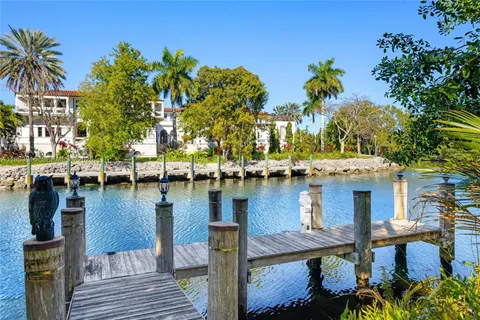 an aerial view of a houses with a lake view