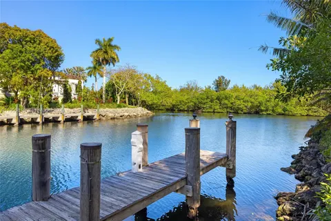 an aerial view of a house with a yard and garden