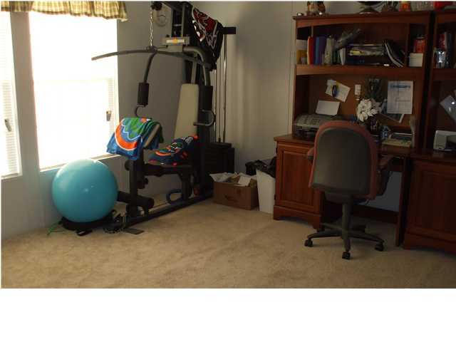 477 Don Graff Road Freeport, FL 32439 - Photo 13 of 15 a room with furniture and a gym machine