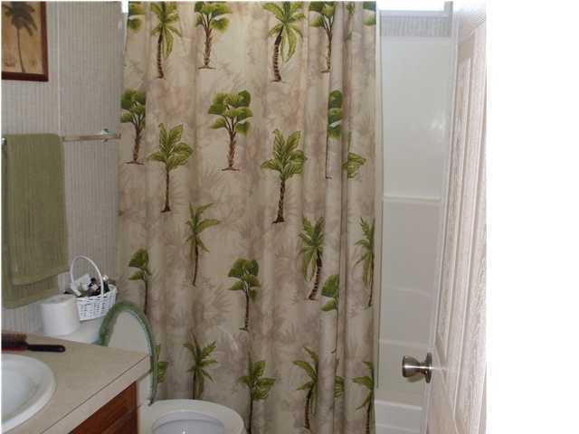 477 Don Graff Road Freeport, FL 32439 - Photo 14 of 15 a bathroom with a shower and a sink
