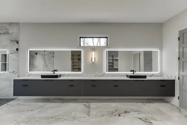 an empty room with a ceiling fan and a window