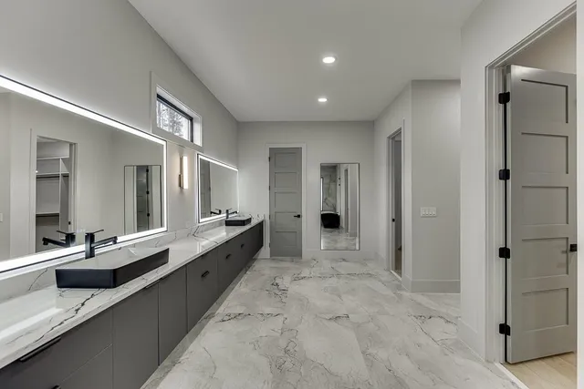 a view of an empty room with glass door and a window