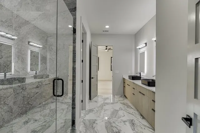 an aerial view of a chairs and table on the roof deck