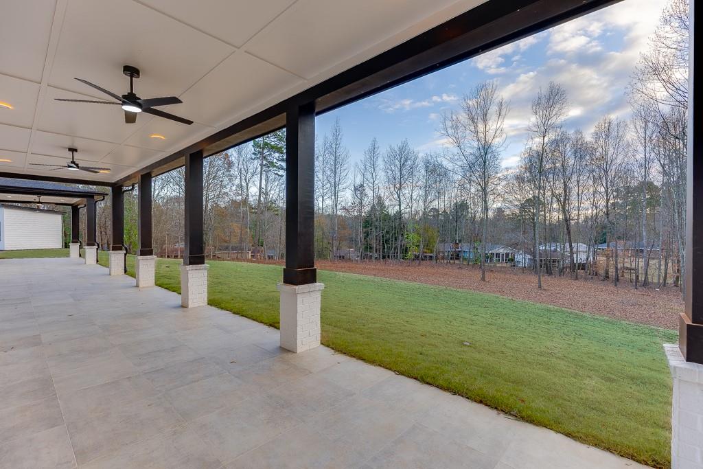 4238 Hamilton Mill Road Buford, GA 30519 - Photo 66 of 100 a view of a porch with furniture and a yard