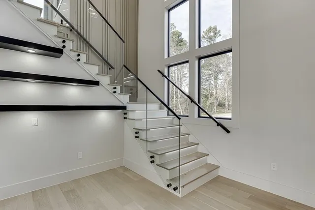 a large kitchen with stainless steel appliances kitchen island a large counter top and oven