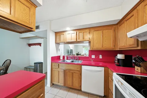 a kitchen with a stove and a refrigerator