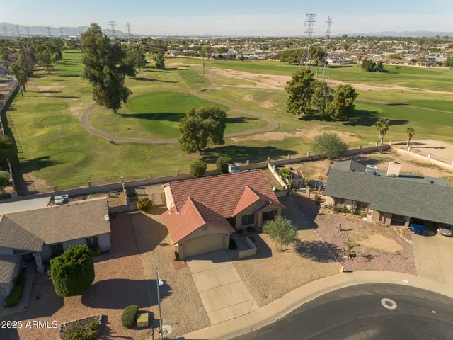 an aerial view of a house with a ocean view