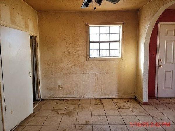 3006 East 3rd Street Lubbock, TX 79403 - Photo 5 of 13 an empty room with windows
