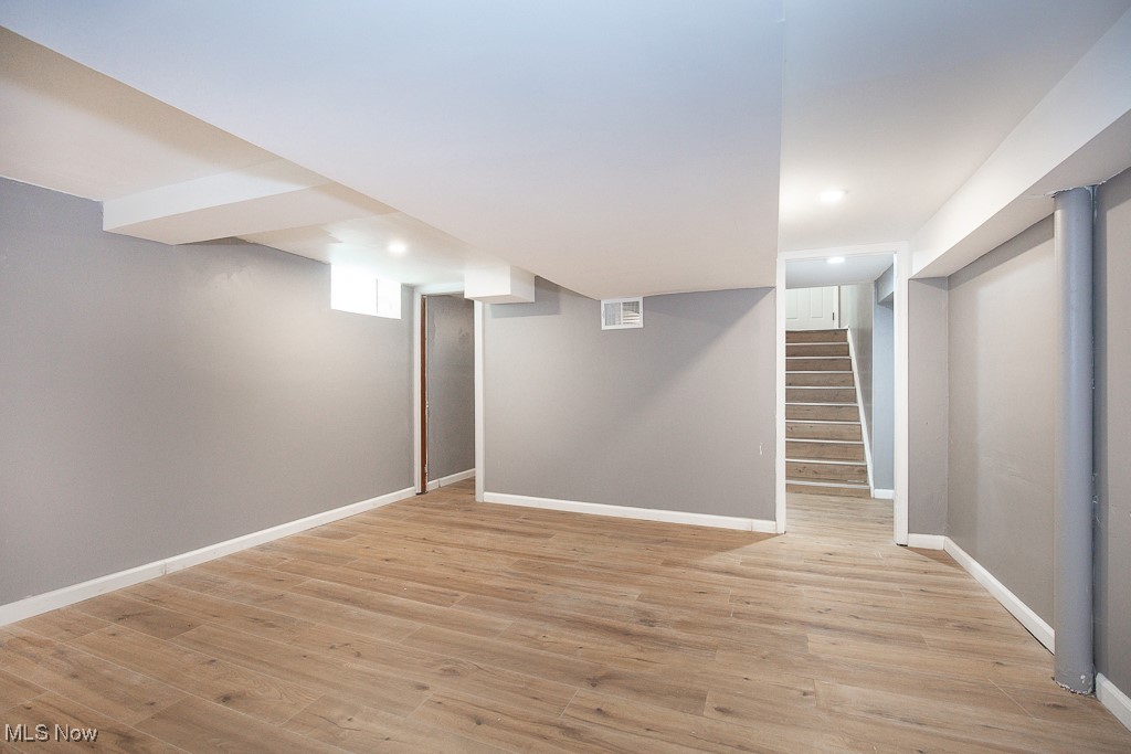 1547 Genesee Road South Euclid, OH 44121 - Photo 27 of 36 Finished basement featuring baseboards, light wood-style floors, stairway, and recessed lighting