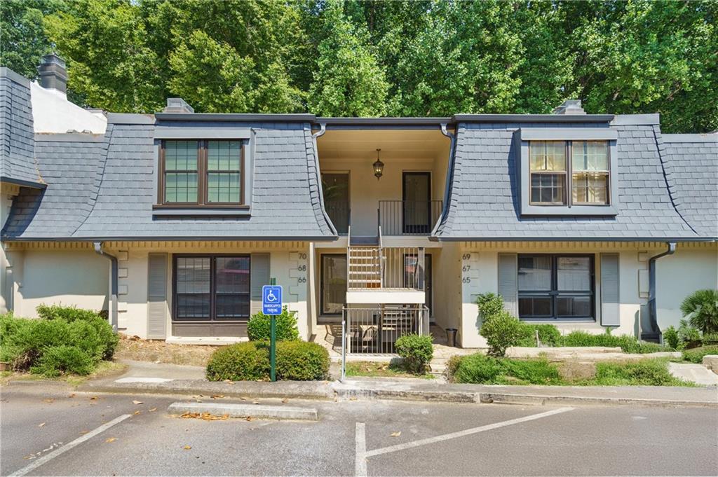 68 La Rue Place Northwest Atlanta, GA 30327 - Photo 1 of 1 front view of house with a small yard