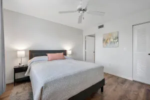 a bedroom with a bed and a lamp