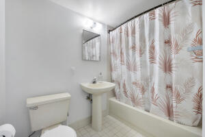 2236 North Cypress Bend Drive, Unit 311 Pompano Beach, FL 33069 - Photo 17 of 56 a bathroom with a sink and toilet