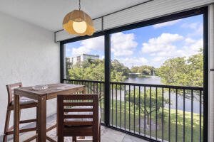 2236 North Cypress Bend Drive, Unit 311 Pompano Beach, FL 33069 - Photo 18 of 56 a view of a city from a balcony
