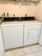 2236 North Cypress Bend Drive, Unit 311 Pompano Beach, FL 33069 - Photo 20 of 56 a view of washer and dryer