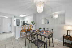2236 North Cypress Bend Drive, Unit 311 Pompano Beach, FL 33069 - Photo 2 of 56 a view of a dining room with furniture