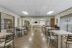 2236 North Cypress Bend Drive, Unit 311 Pompano Beach, FL 33069 - Photo 26 of 56 a view of a dining room with furniture